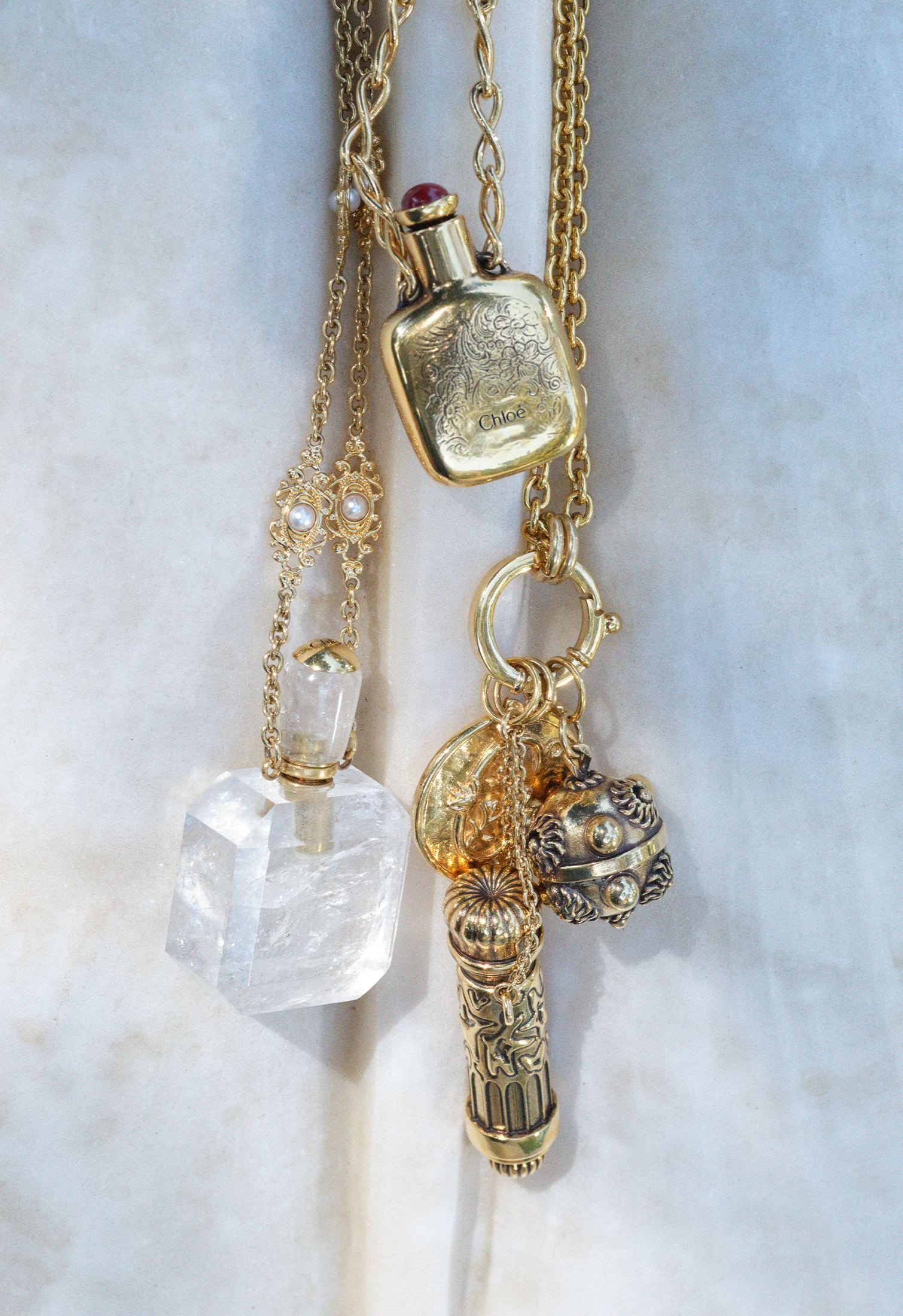 Romantic Christmas Gifts for Girlfriend or Wife: Ideas and Inspiration - Vintage gold necklaces with charms and crystal pendants